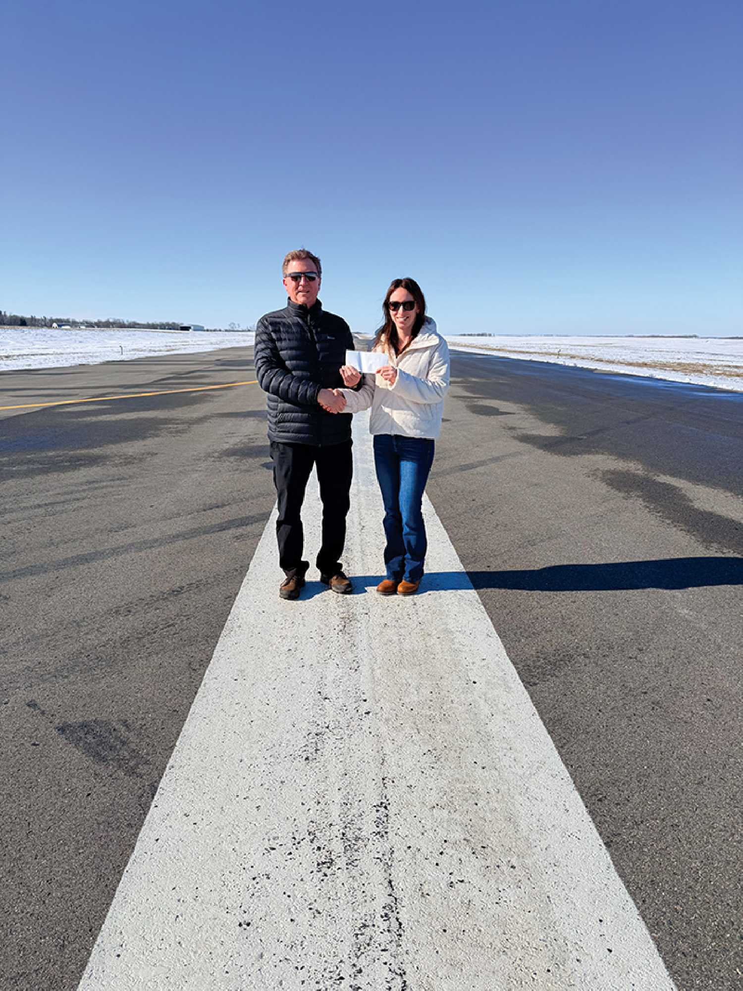 Darcy Rambold made a $50,000 donation to the Moosomin airport expansion project last week. Accepting the donation is Olga McCarthy with the Moosomin Airport Authority.